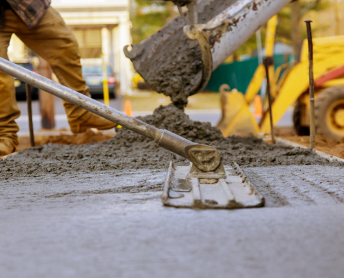 Worker Smoothing Concrete