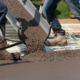Workers Pouring Concrete For A Stamped Floor